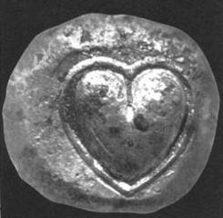 Here is an ancient Cyrene coin bearing the image of a Silphium seed. Its likeness both to the Egyptian Ib and, likewise, to the modern heart symbol is striking.